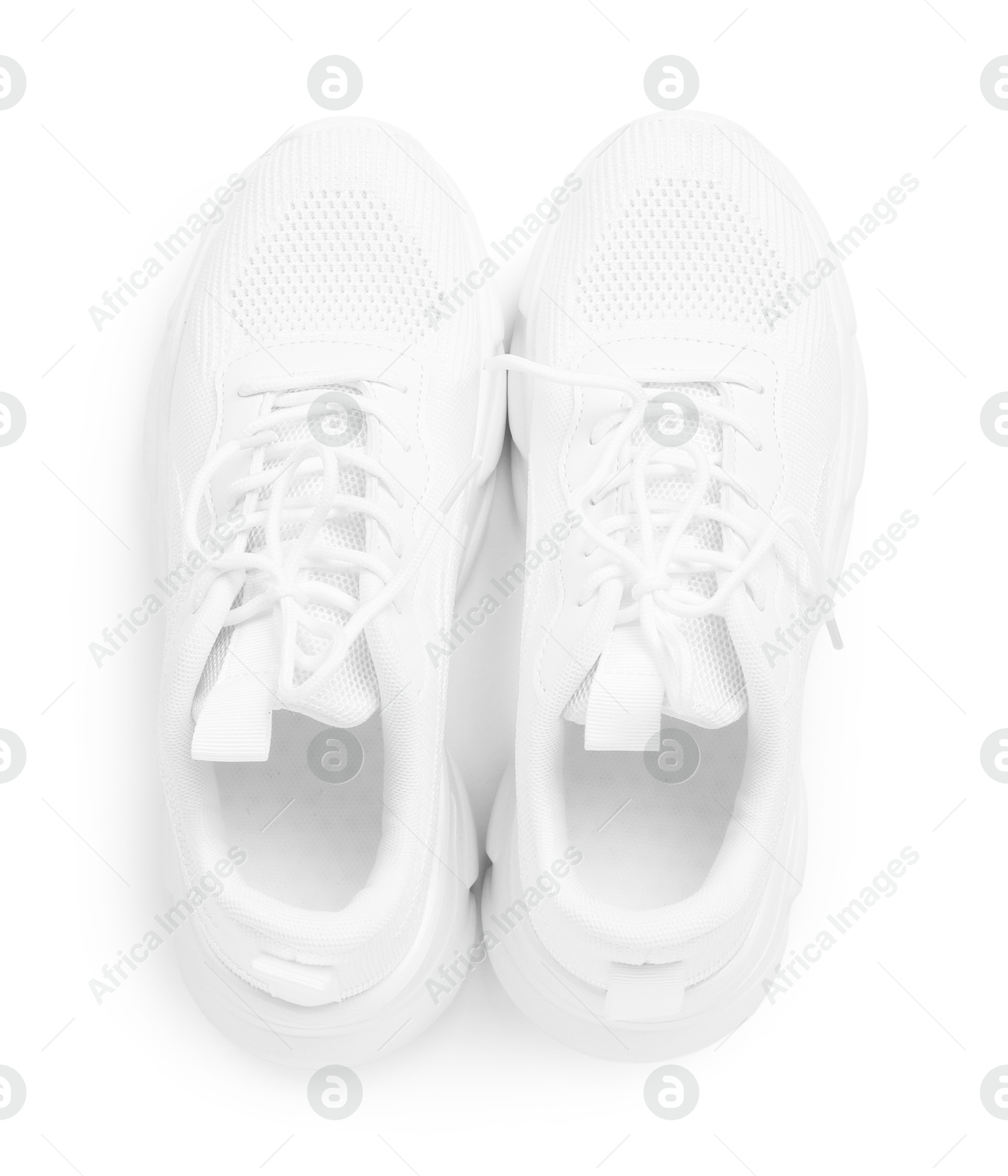 Photo of Pair of stylish sneakers isolated on white, top view