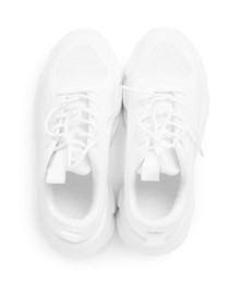 Photo of Pair of stylish sneakers isolated on white, top view