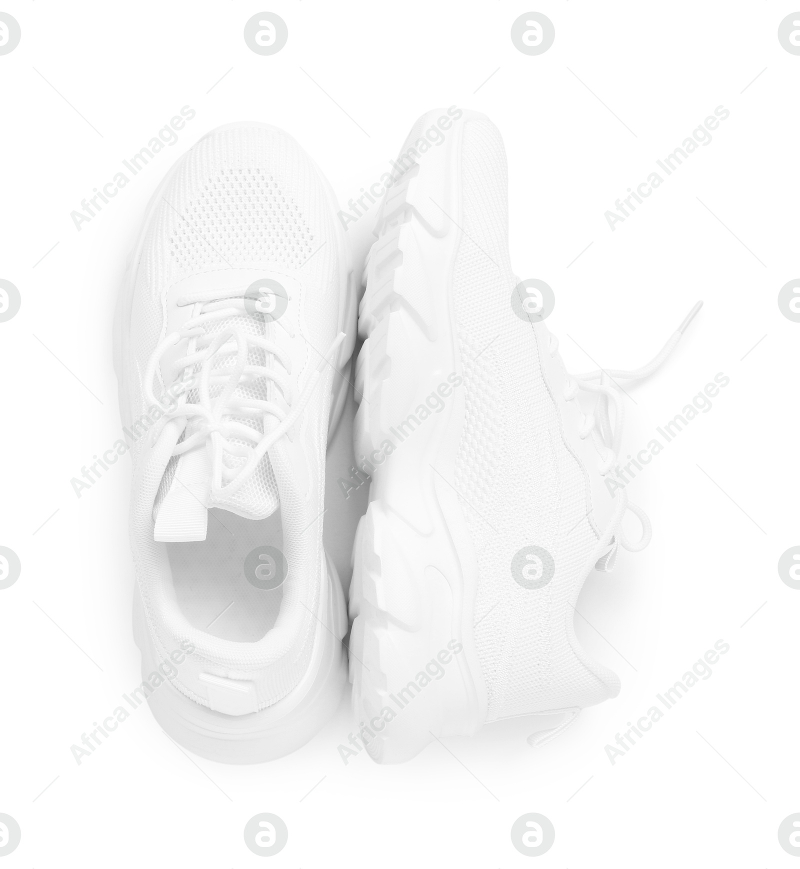 Photo of Pair of stylish sneakers isolated on white, top view