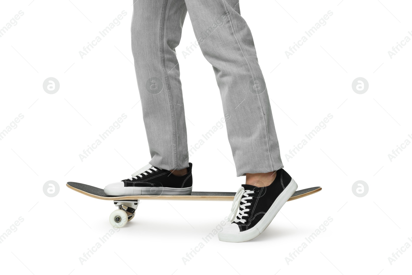 Photo of Man riding skateboard on white background, closeup