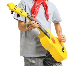 Photo of Little girl playing ukulele on white background, closeup