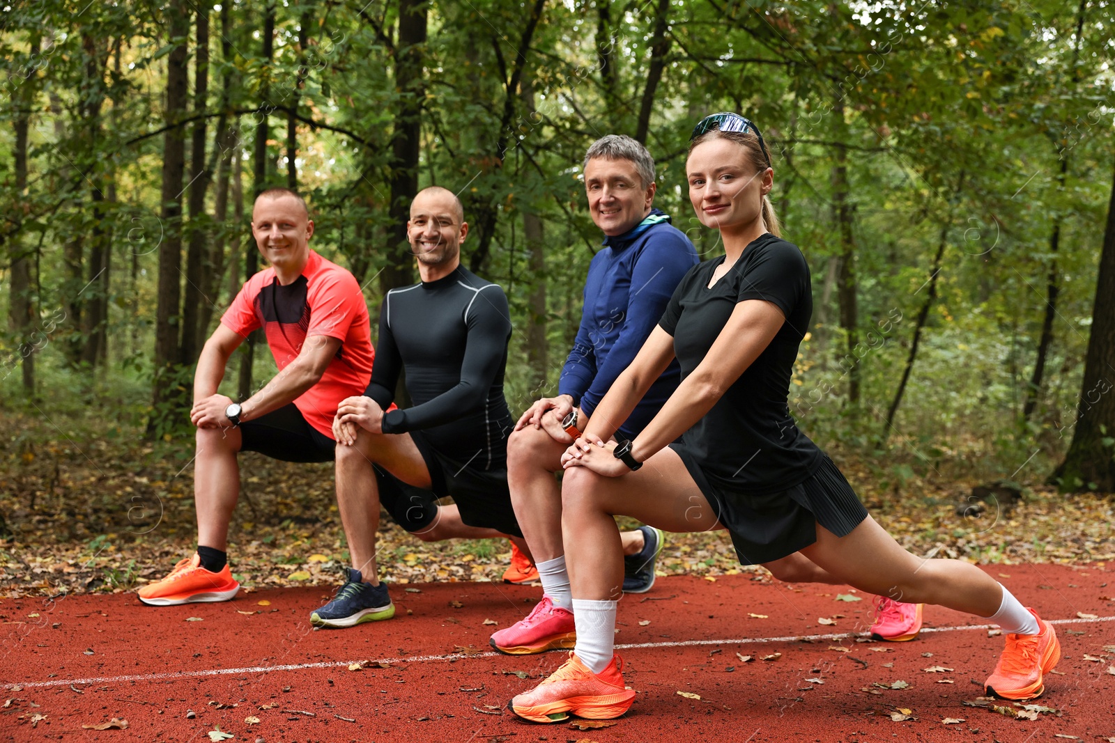 Photo of Group of people stretching in park. Healthy lifestyle