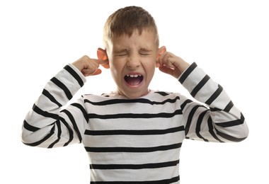 Photo of Little boy covering his ears with fingers on white background