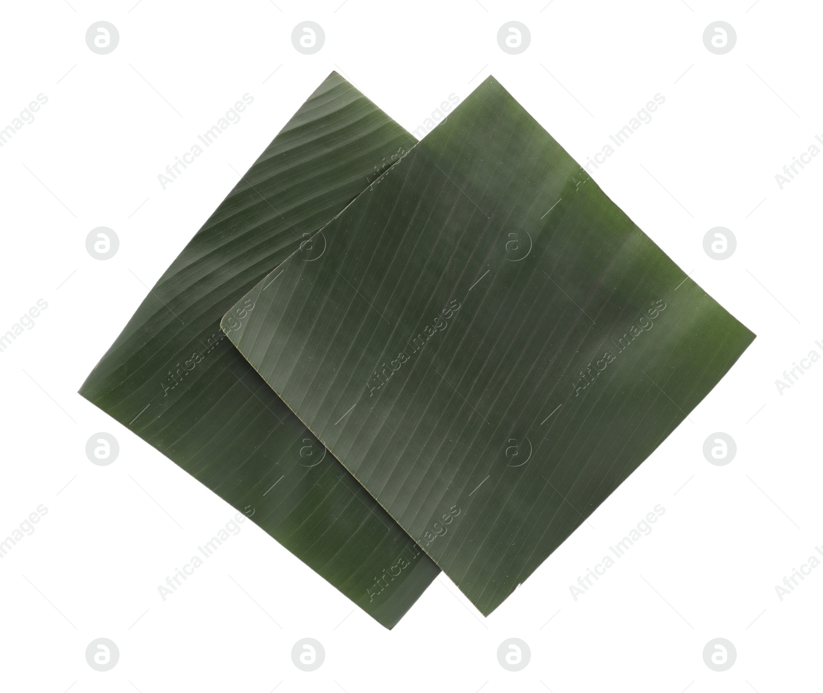 Photo of Pieces of banana leaves isolated on white, top view. Traditional meal serving