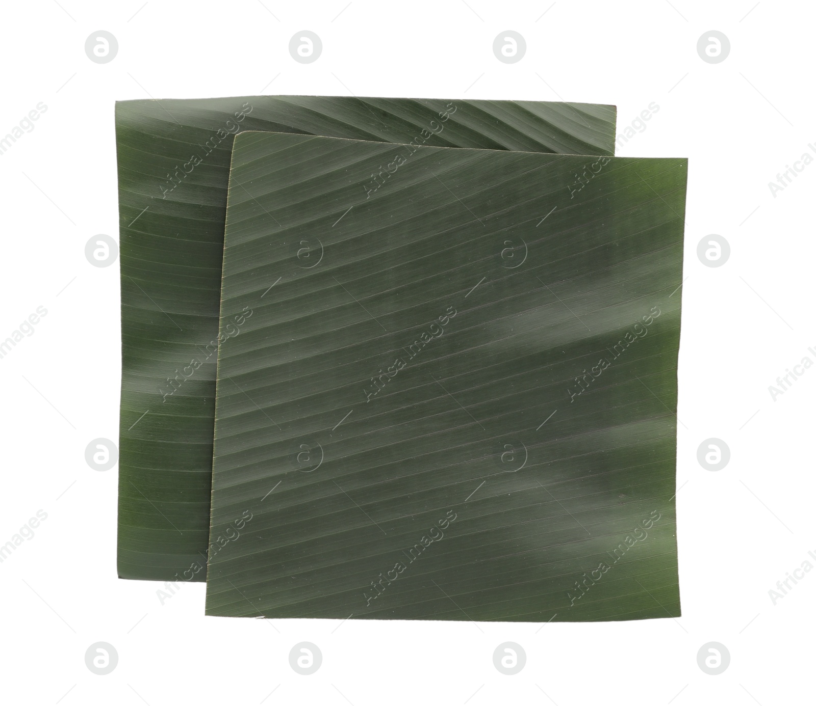 Photo of Pieces of banana leaves isolated on white, top view. Traditional meal serving