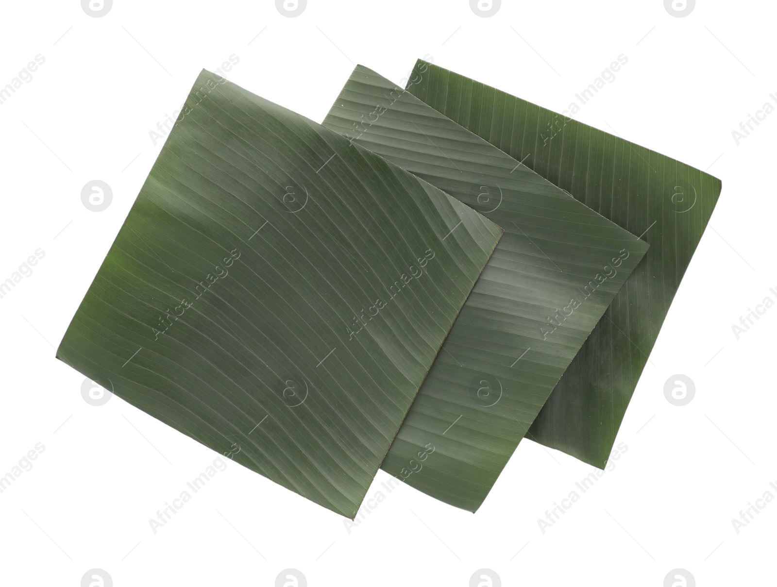 Photo of Pieces of banana leaves isolated on white, top view. Traditional meal serving