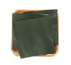 Photo of Pieces of banana leaves isolated on white, top view. Traditional meal serving