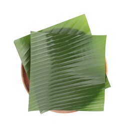 Photo of Pieces of banana leaves isolated on white, top view. Traditional meal serving