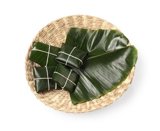 Photo of Cut banana leaves with food isolated on white, top view. Healthy eco serving