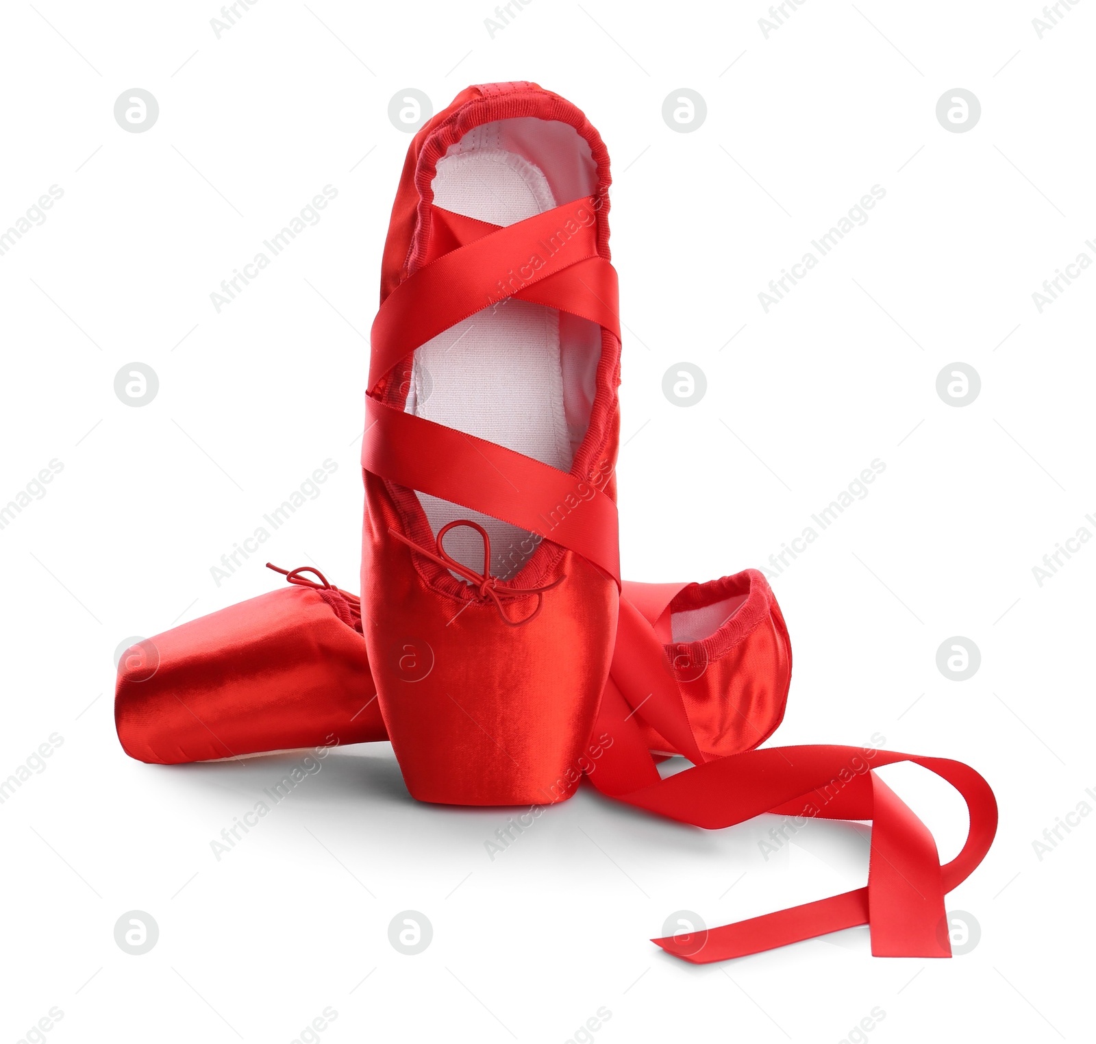 Photo of Pair of beautiful red pointe shoes isolated on white