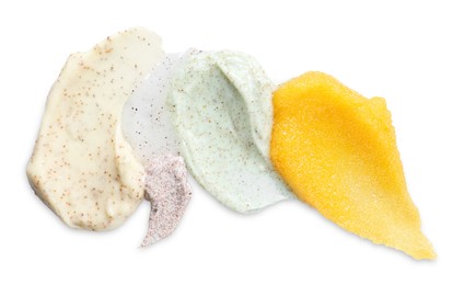 Photo of Samples of different body scrubs isolated on white, top view