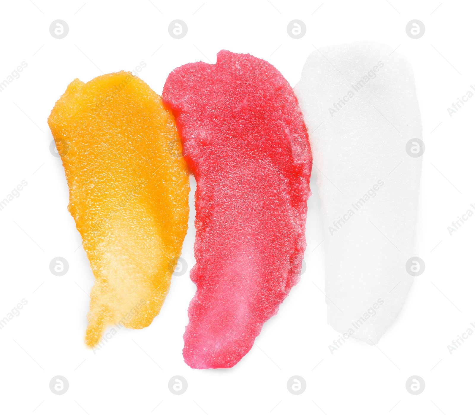 Photo of Smears of different body scrubs isolated on white, top view