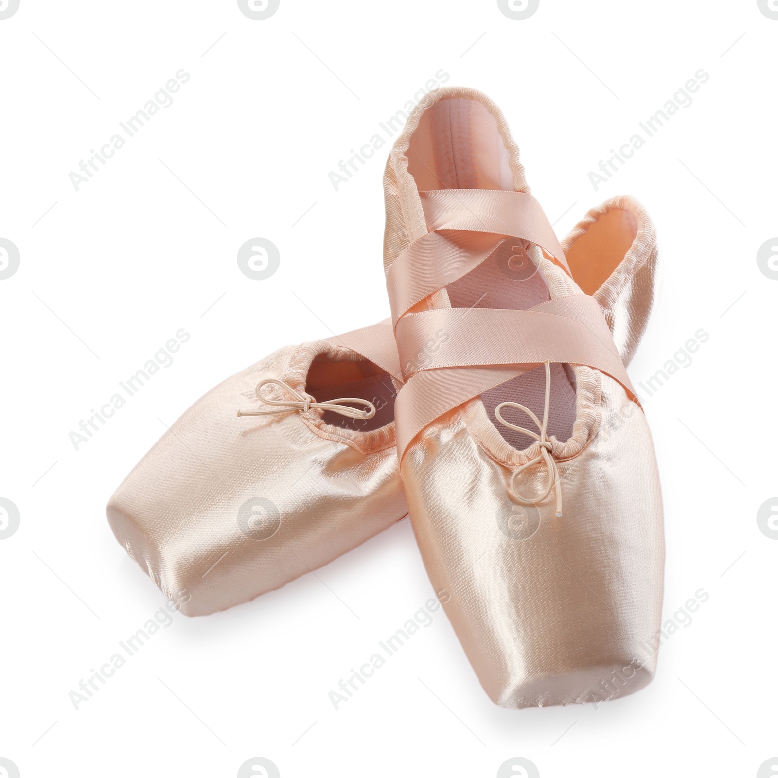 Photo of Pair of beautiful beige pointe shoes isolated on white