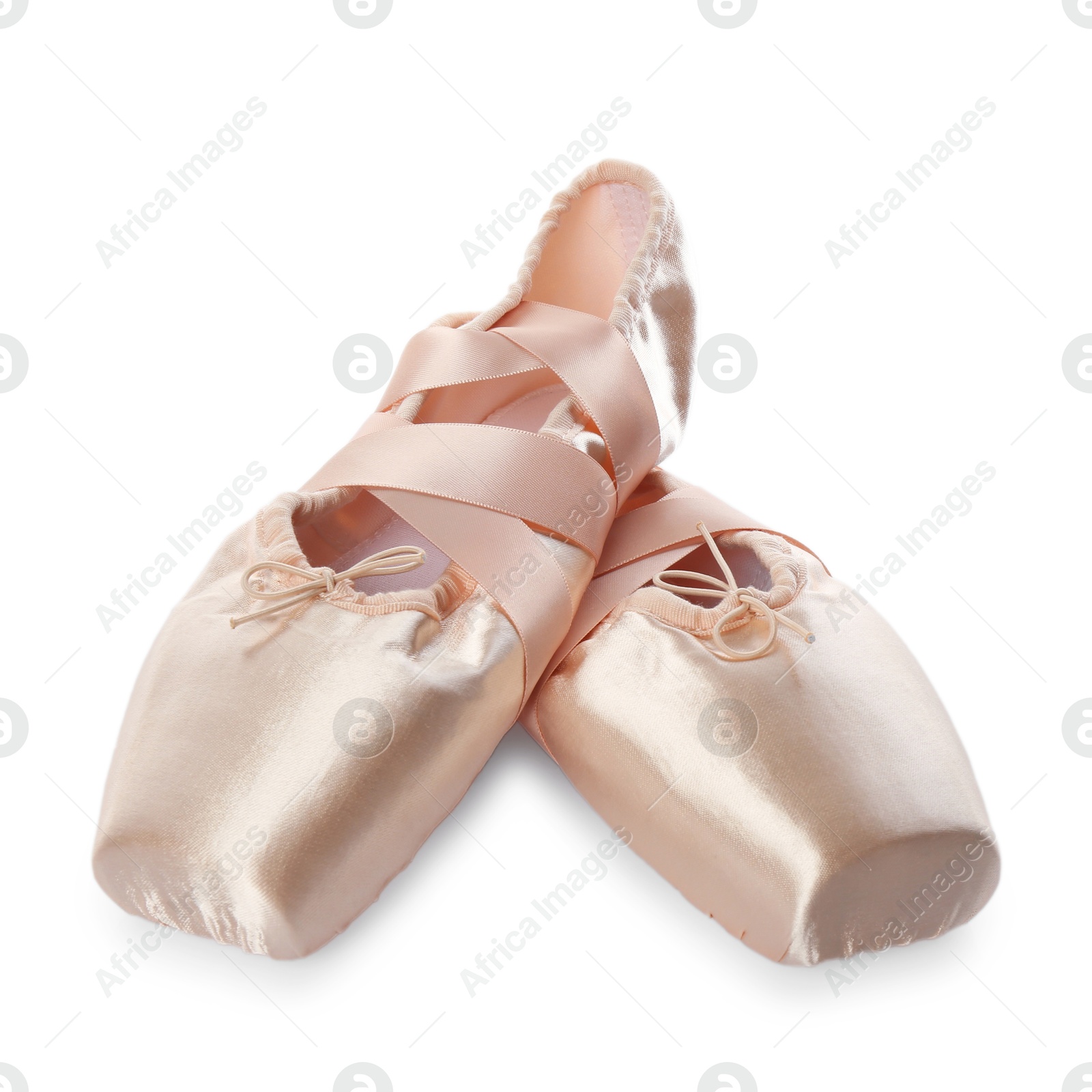 Photo of Pair of beautiful beige pointe shoes isolated on white