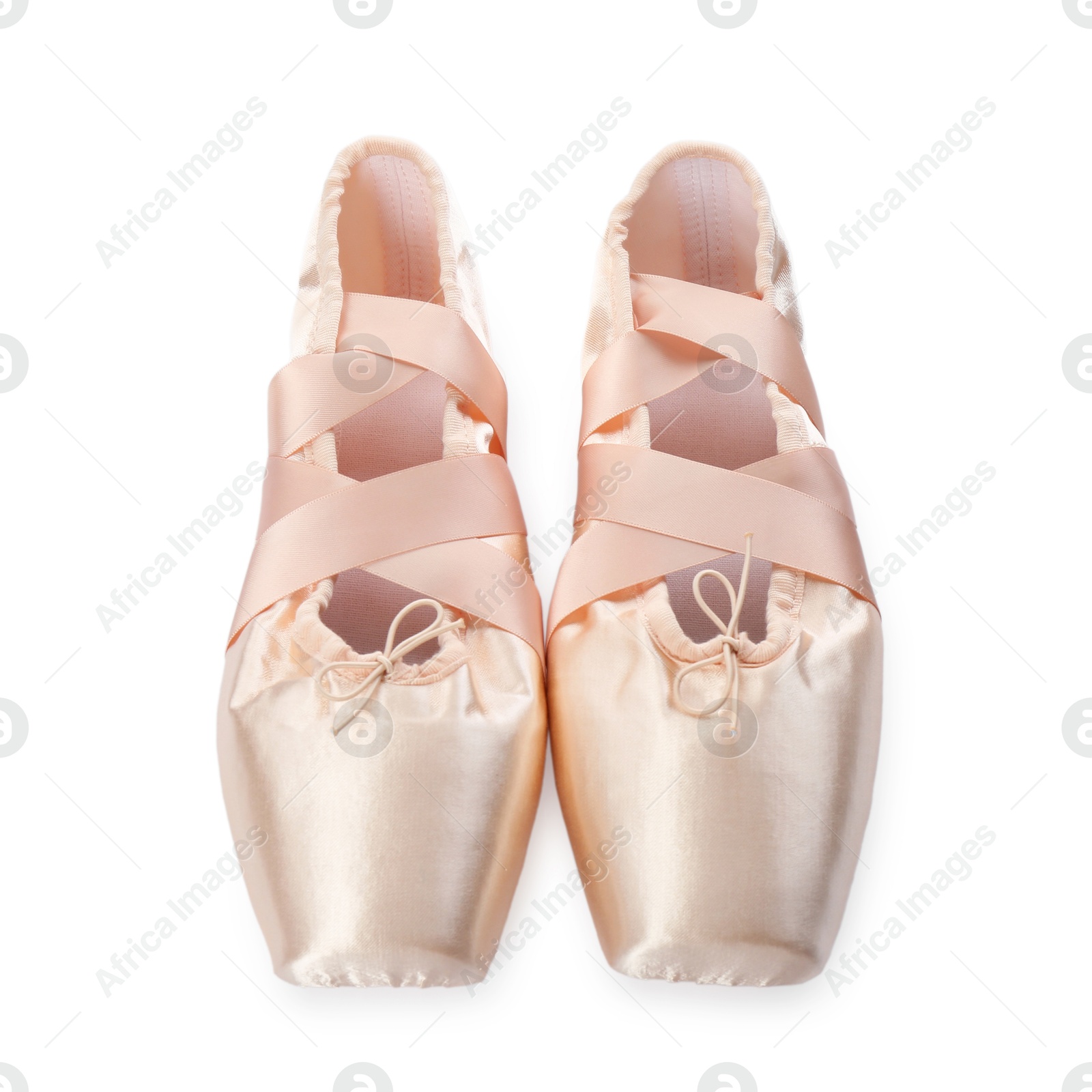 Photo of Pair of beautiful beige pointe shoes isolated on white