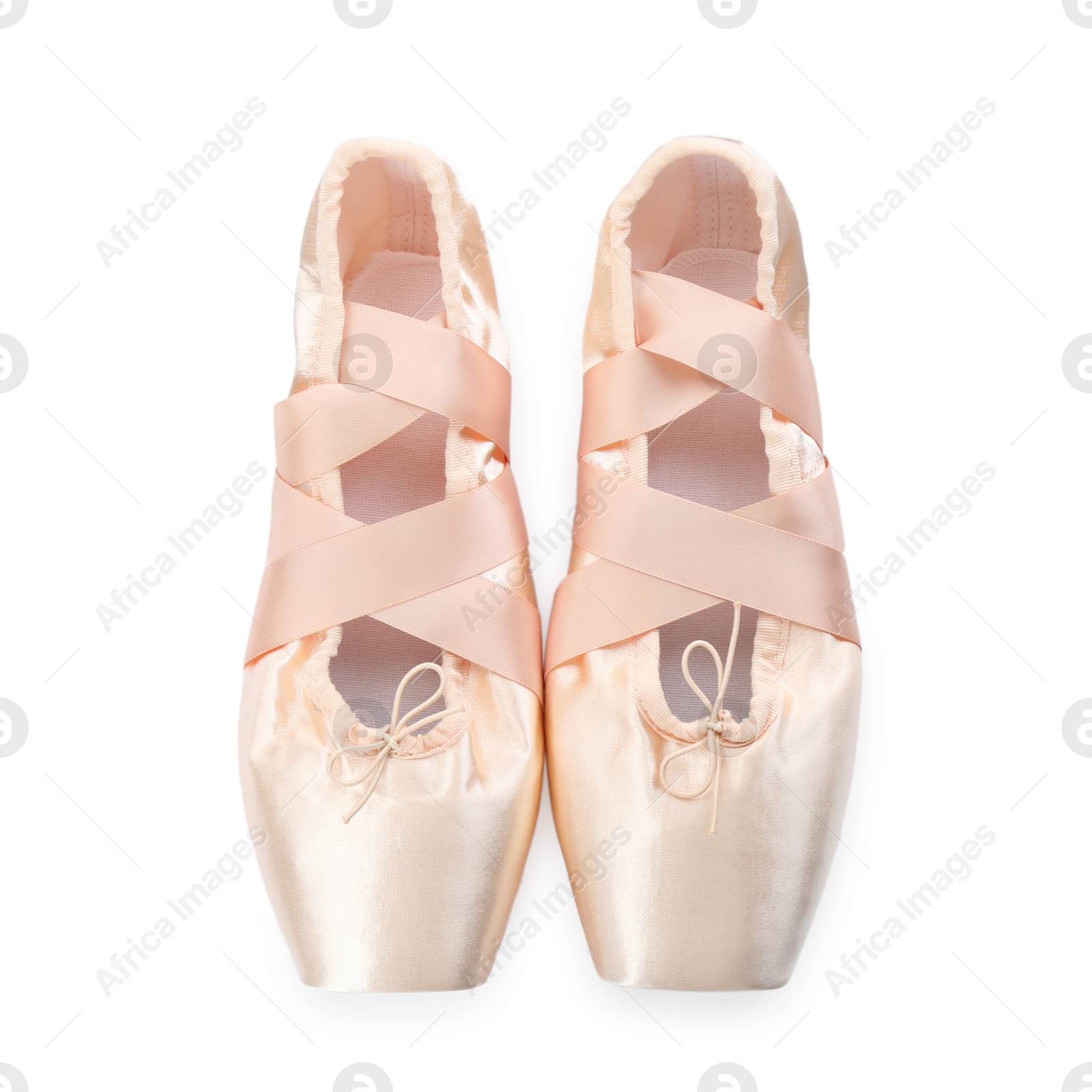 Photo of Pair of beautiful beige pointe shoes isolated on white, top view