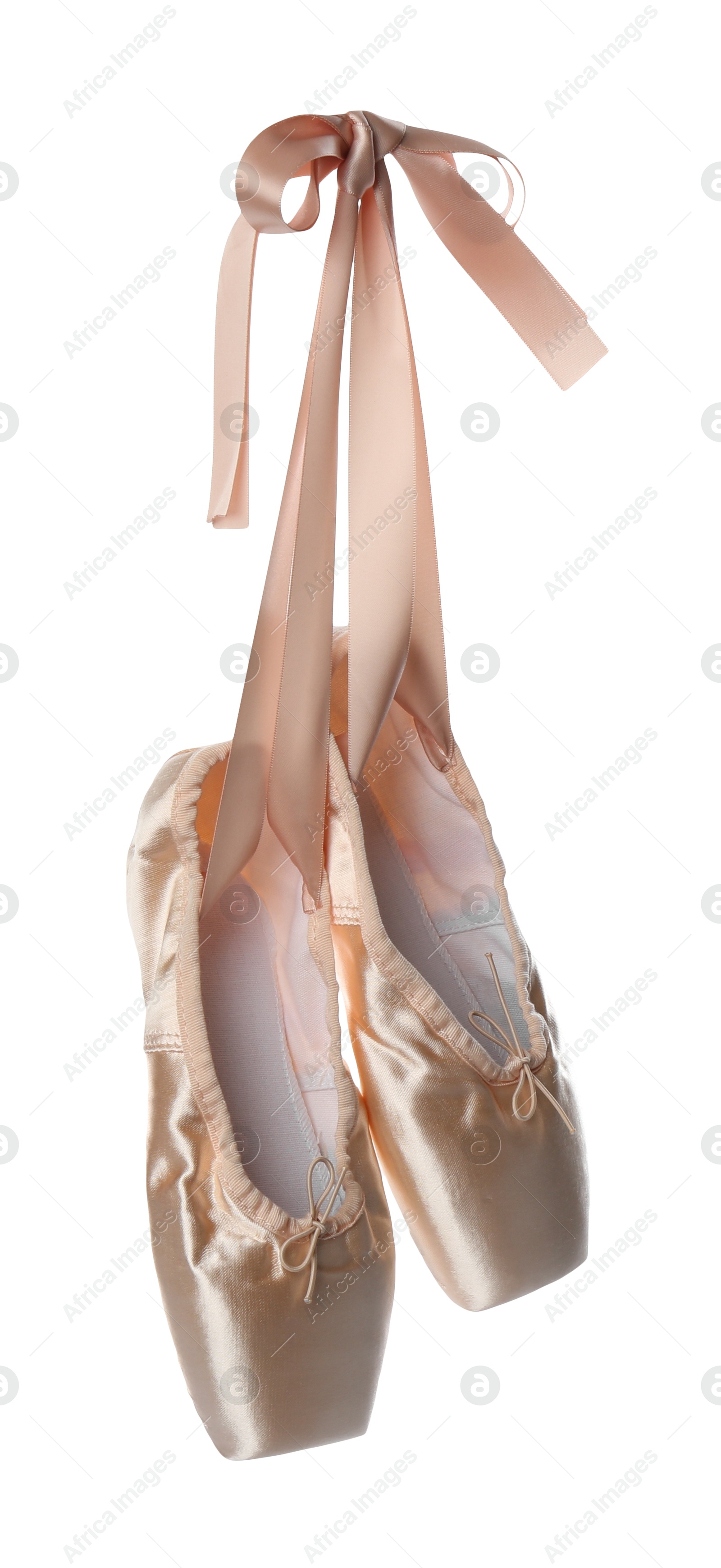 Photo of Pair of beautiful beige pointe shoes isolated on white