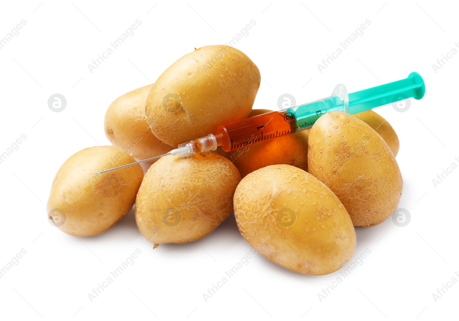 Photo of GMO concept. Potatoes and syringe isolated on white