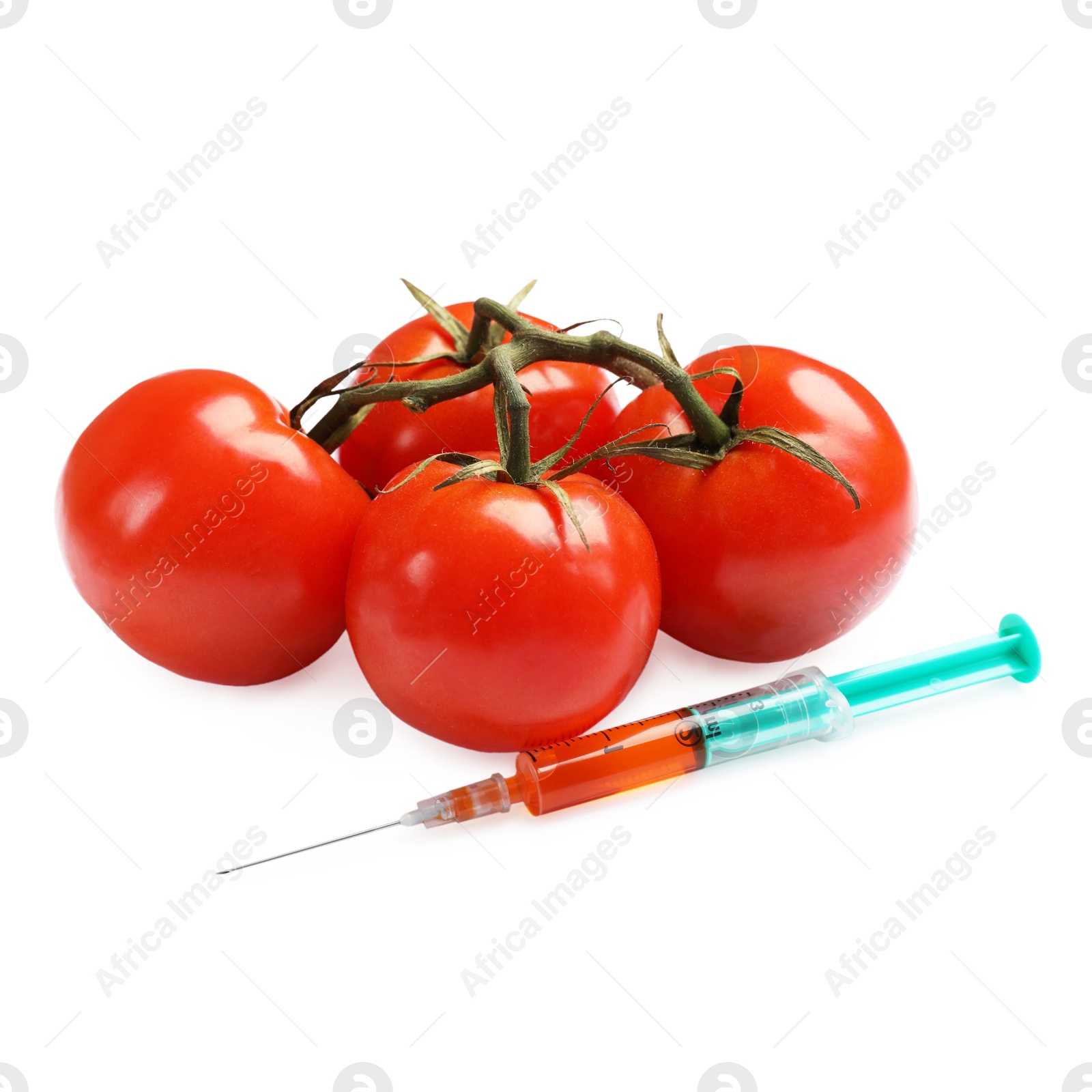 Photo of GMO concept. Fresh tomatoes and syringe isolated on white