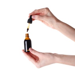 Photo of Woman with bottle of topical iodine on white background, closeup