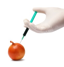 Photo of GMO concept. Scientist injecting something into onion against white background, closeup