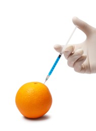 Photo of GMO concept. Scientist injecting something into fresh orange against white background, closeup