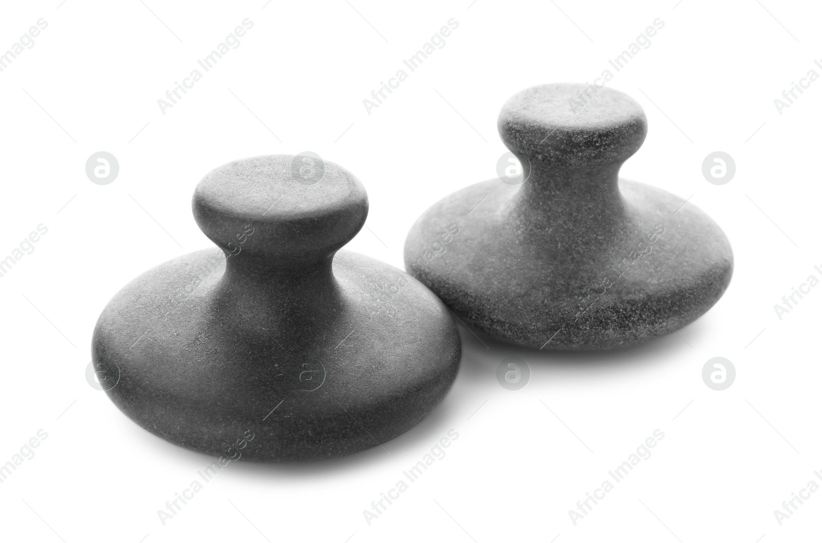 Photo of Massage stones isolated on white. Spa treatment