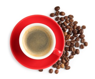 Photo of Red cup with coffee and roasted beans isolated on white, top view