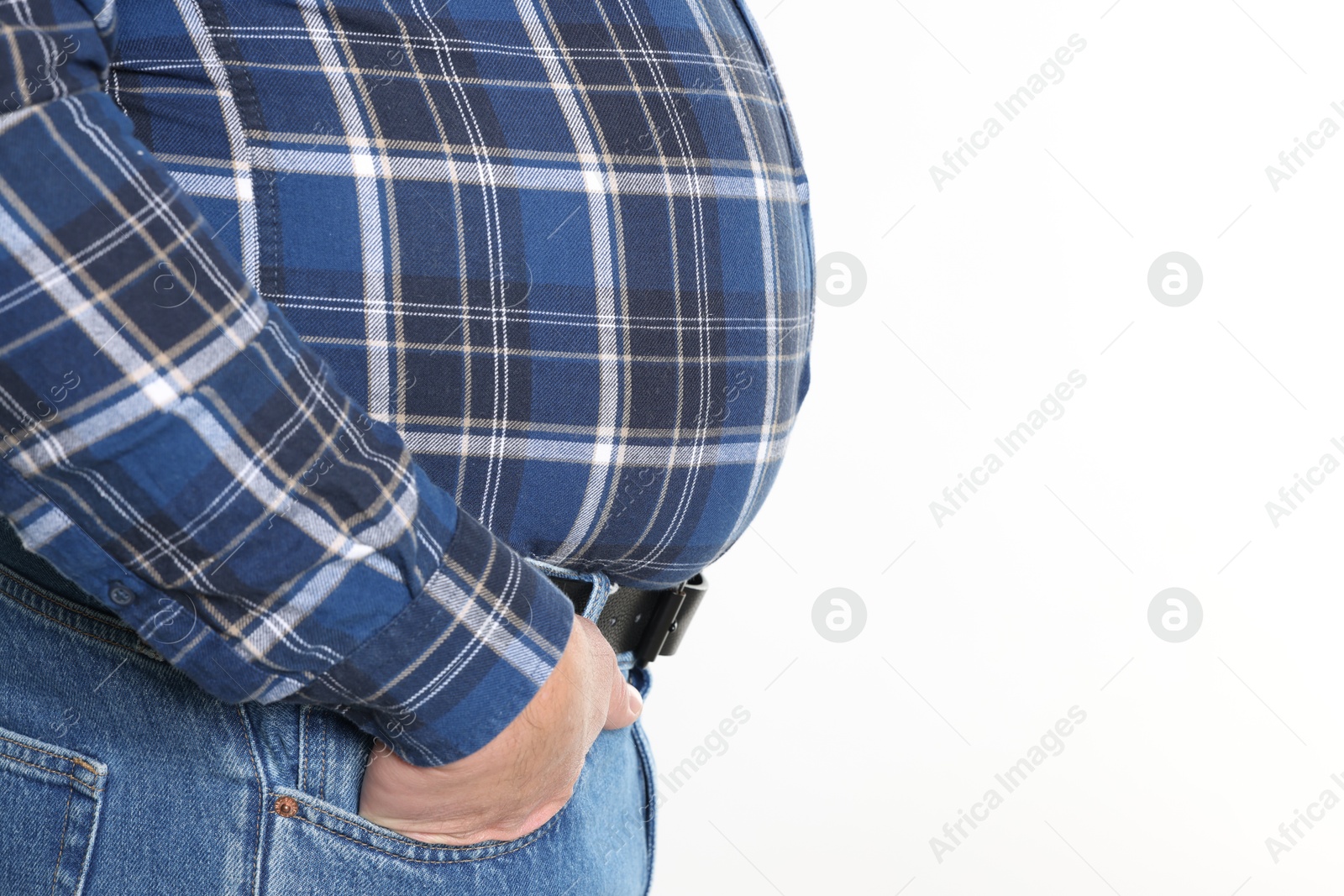 Photo of Overweight man in tight shirt on white background, closeup. Space for text