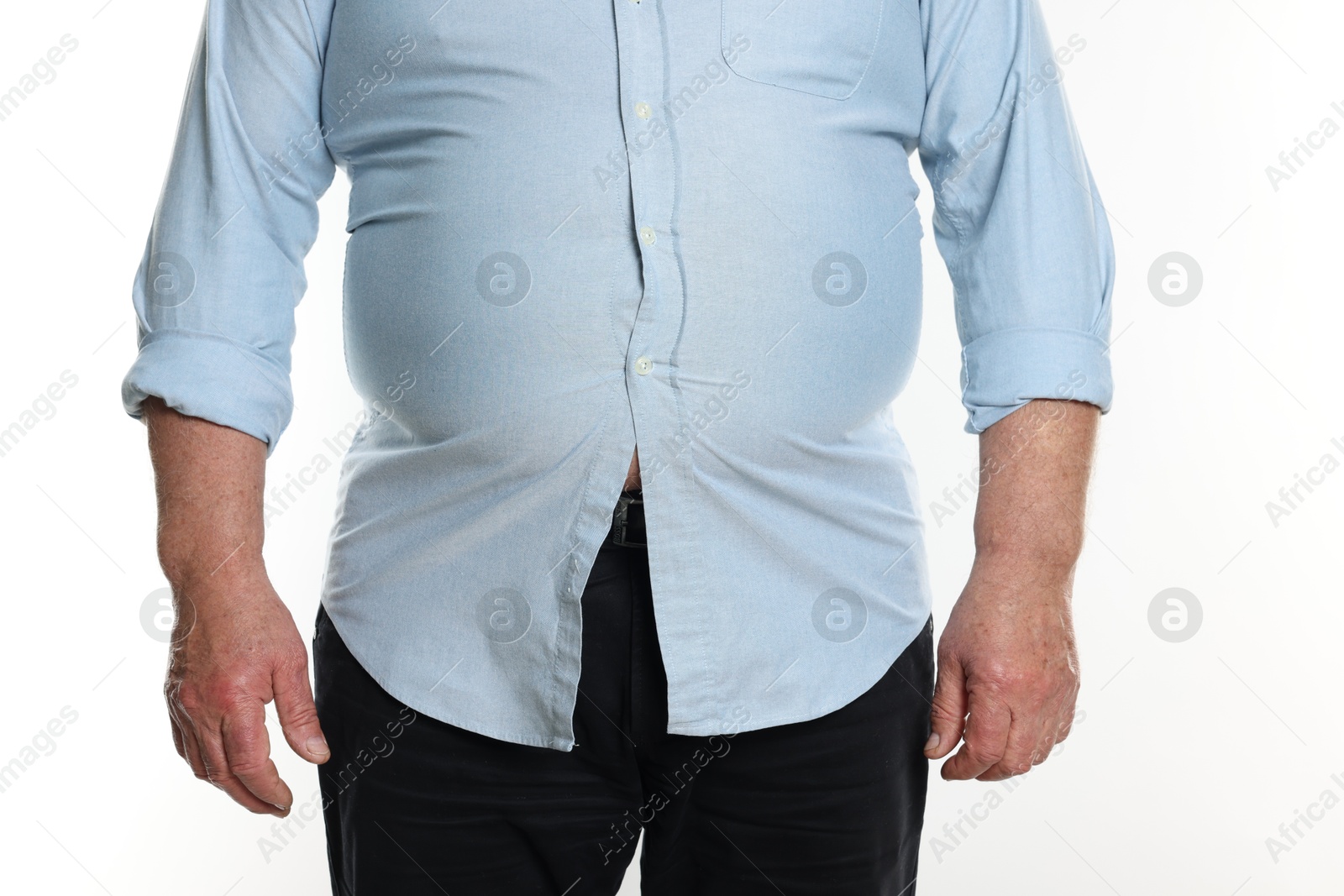 Photo of Overweight man in tight shirt on white background, closeup