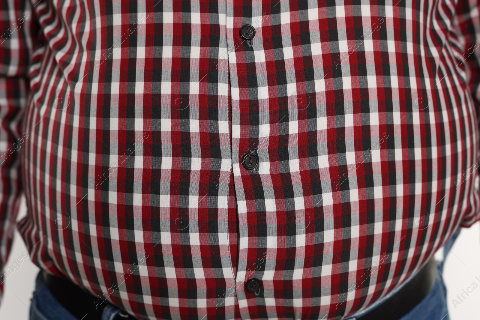 Photo of Overweight man in tight shirt, closeup view