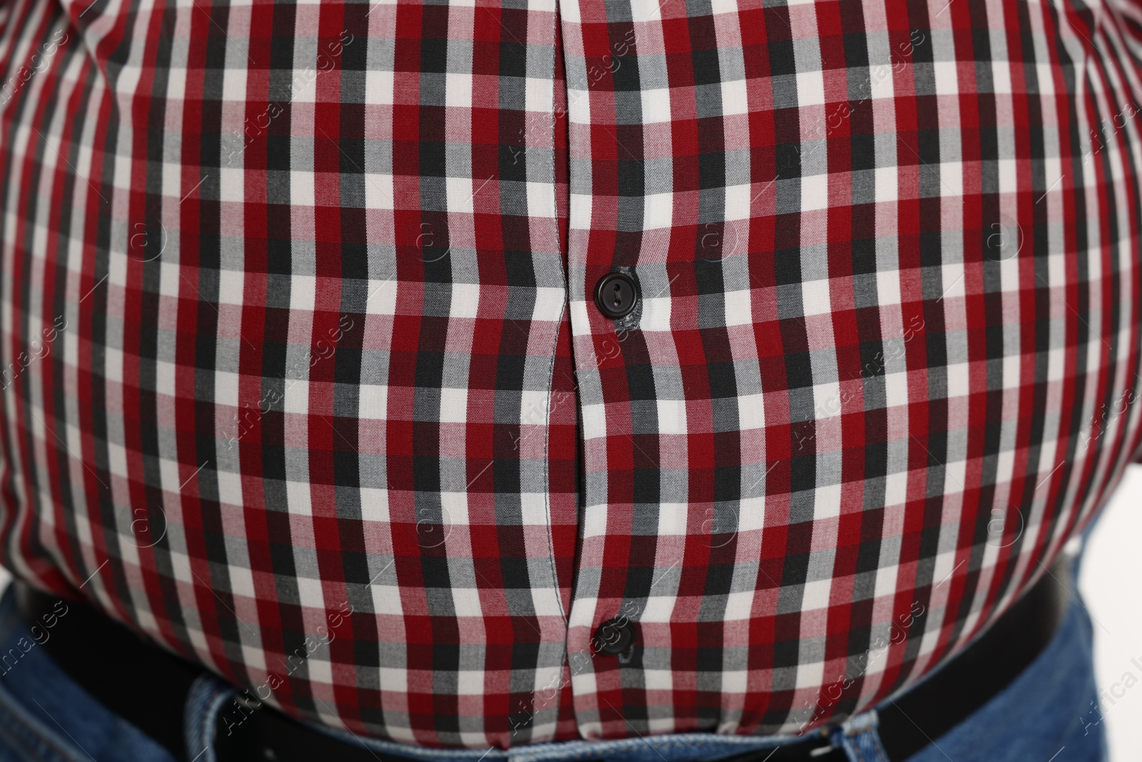 Photo of Overweight man in tight shirt, closeup view