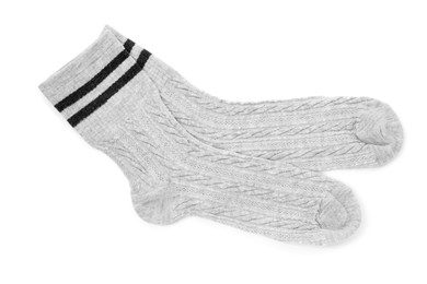 Photo of Pair of soft socks isolated on white, top view