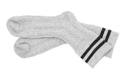 Photo of Pair of soft socks isolated on white, top view