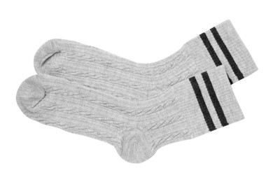 Photo of Pair of soft socks isolated on white, top view