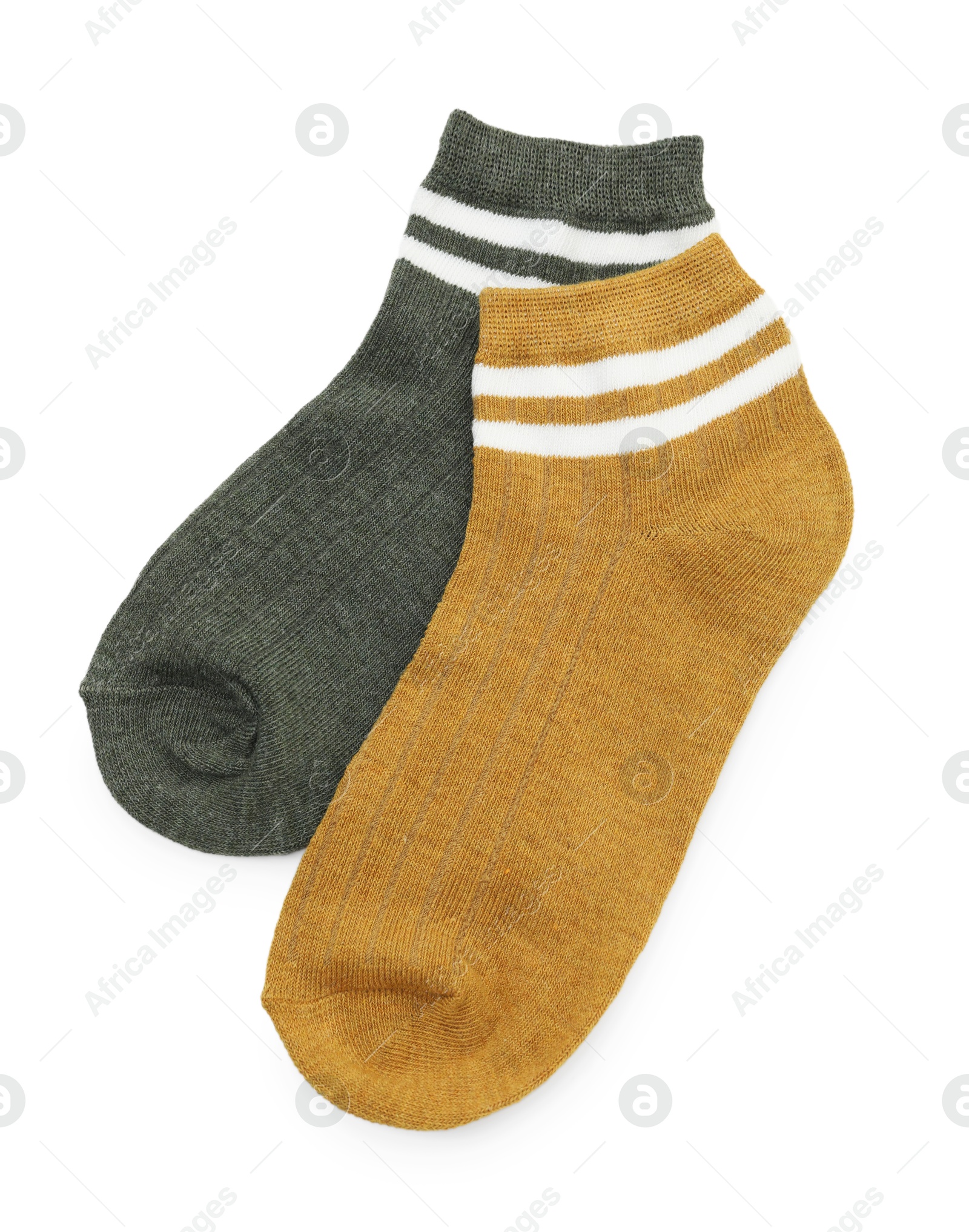 Photo of Pairs of soft socks isolated on white, top view