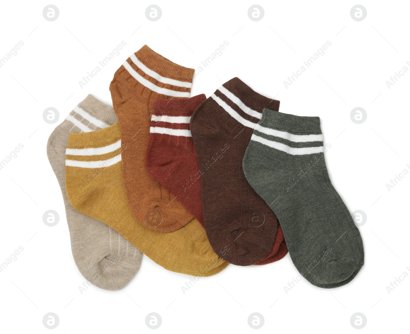 Photo of Pairs of soft socks isolated on white, top view