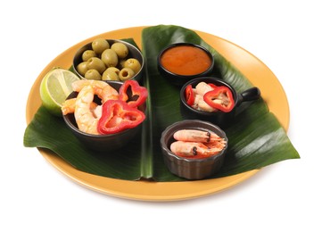 Photo of Cut banana leaf with different food and sauce isolated on white. Healthy eco serving