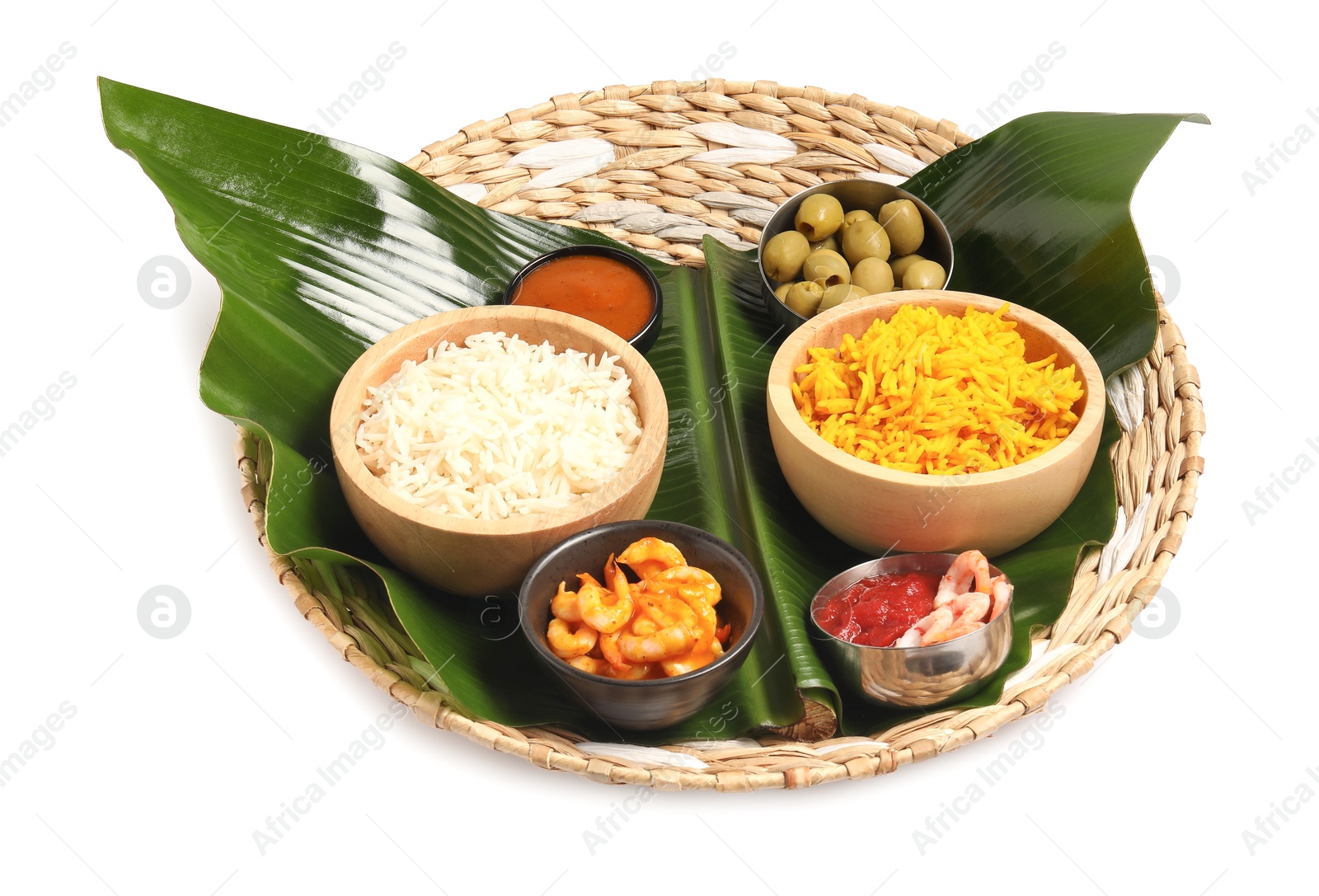 Photo of Piece of banana leaf with different food and sauce isolated on white. Healthy eco serving