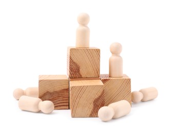 Photo of Human figures on wooden blocks near fallen ones against white background. Competition concept