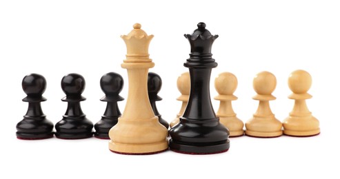 Photo of Black and white chess queens in front of pawns on white background. Competition concept