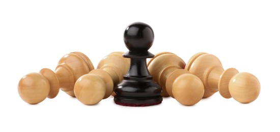 Photo of Black pawn among fallen white ones on white background. Competition concept