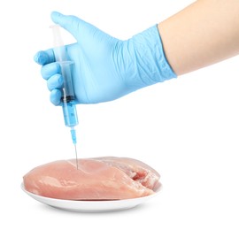 Photo of GMO concept. Scientist injecting something into piece of chicken on white background, closeup