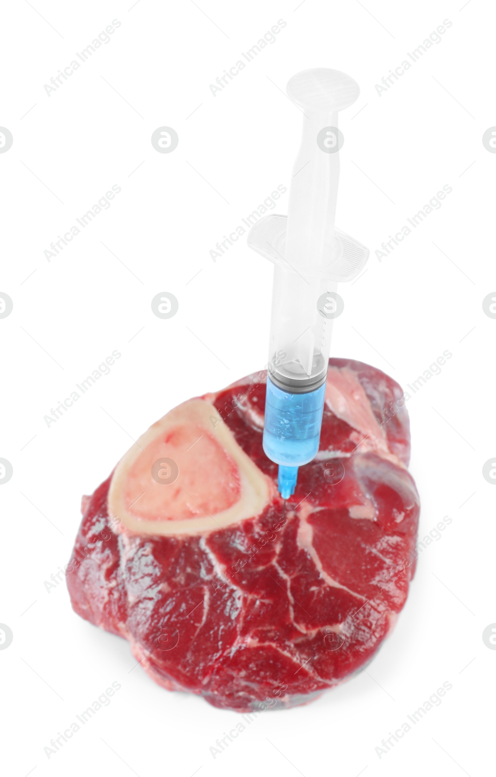 Photo of GMO concept. Piece of meat and syringe isolated on white