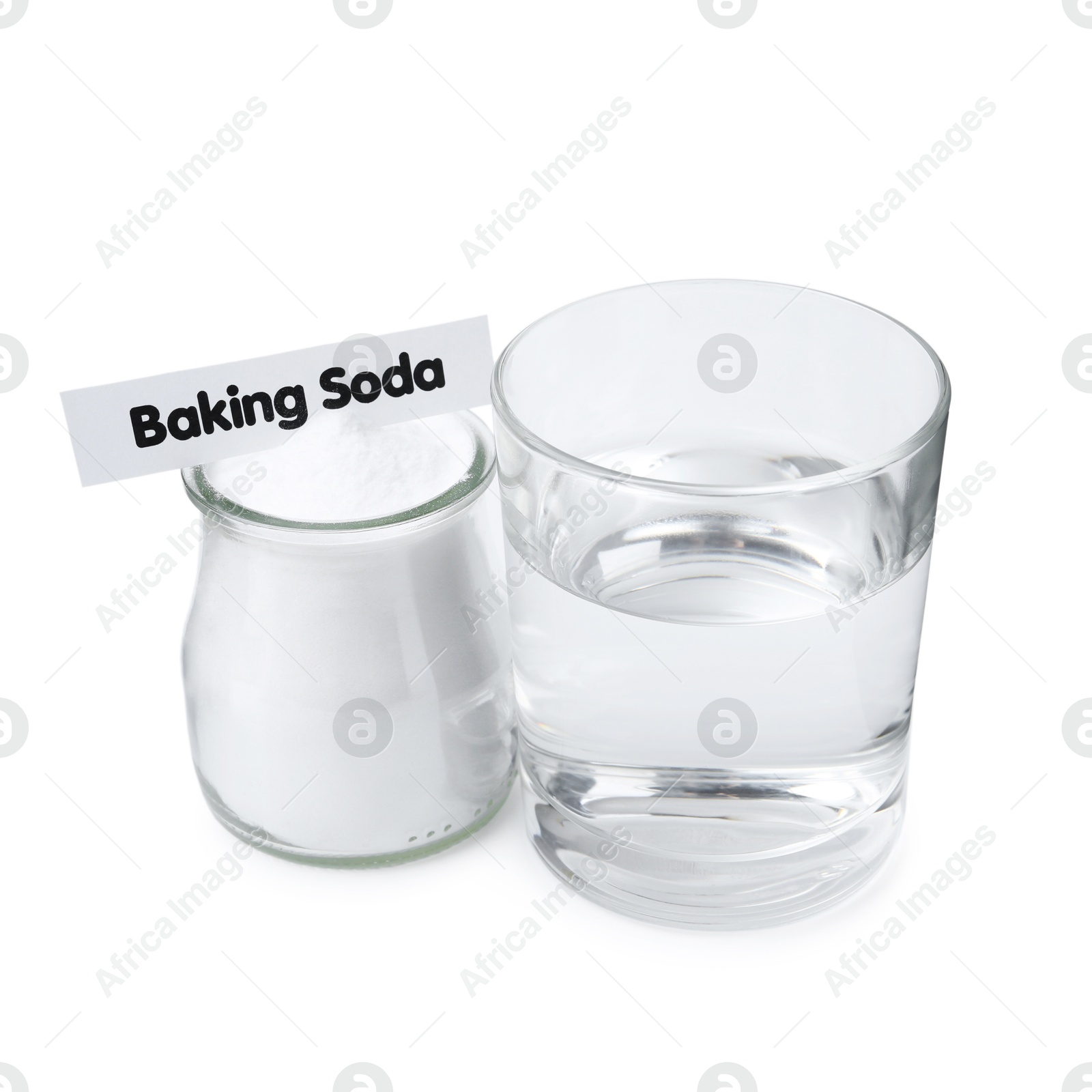 Photo of Glass of water and baking soda on white background