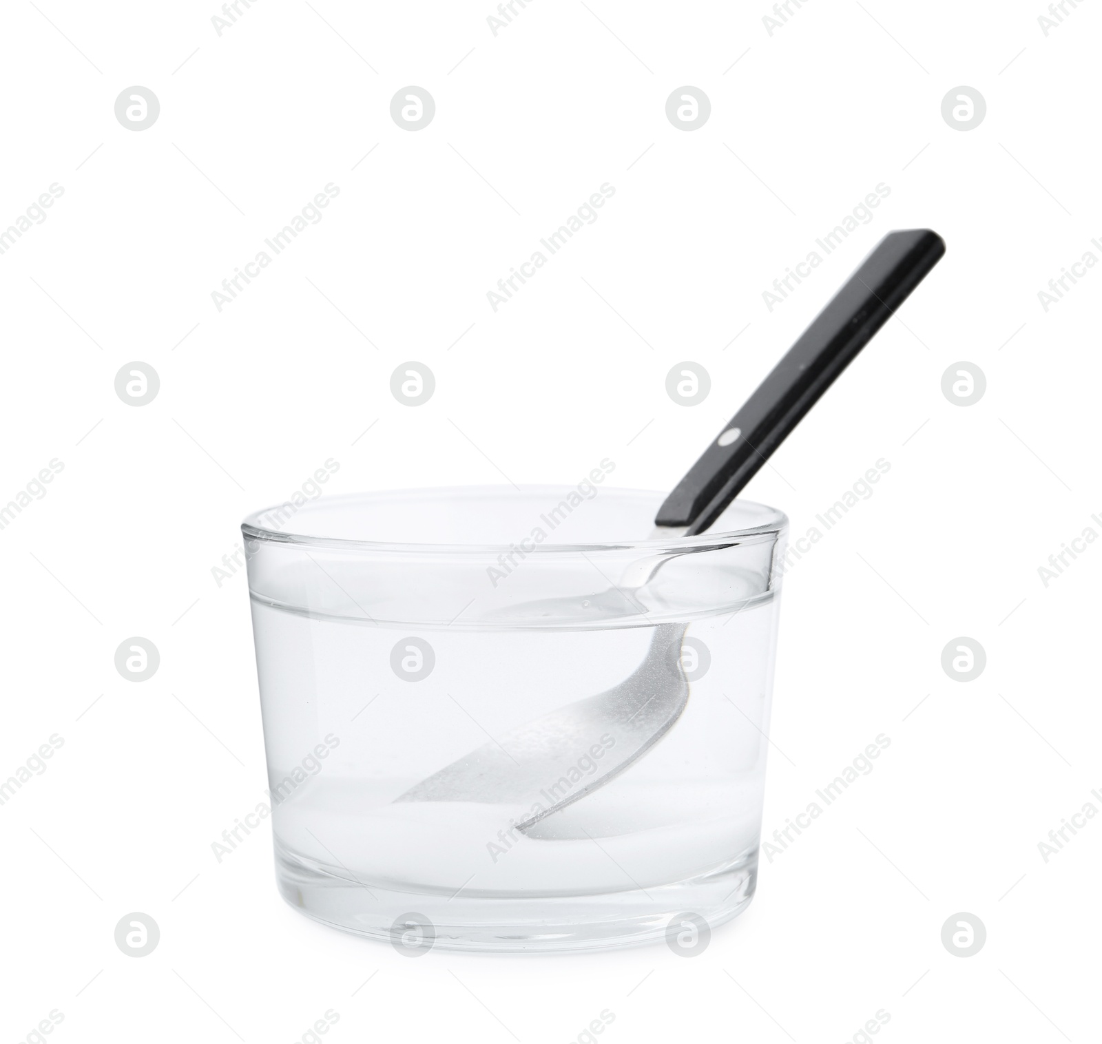 Photo of Glass of water with baking soda and spoon isolated on white