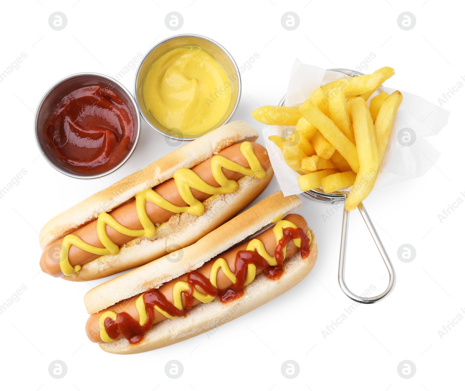 Photo of Tasty hot dogs with fries and sauces isolated on white, top view