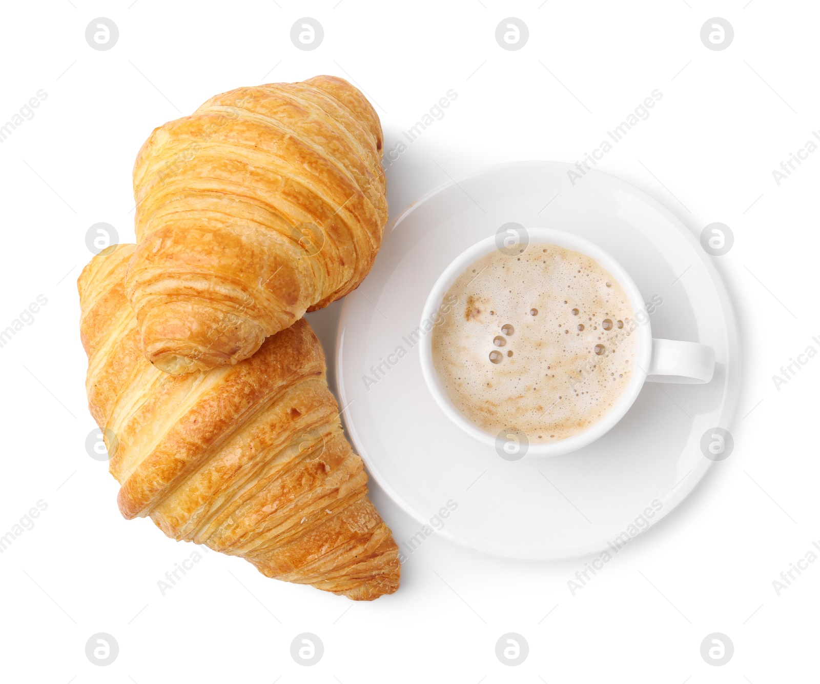 Photo of Tasty fresh croissants and cup of coffee isolated on white, top view. Puff pastry