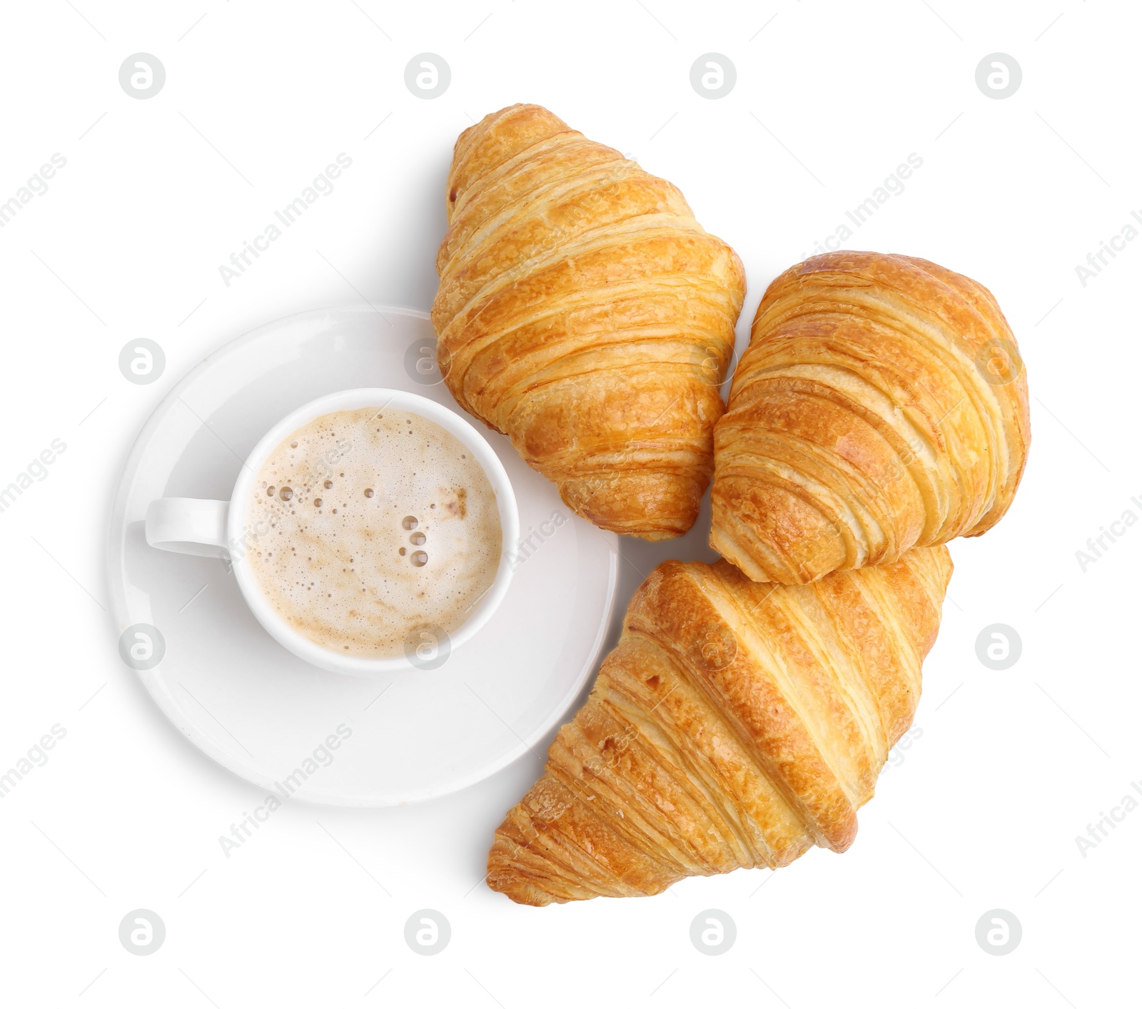 Photo of Tasty fresh croissants and cup of coffee isolated on white, top view. Puff pastry