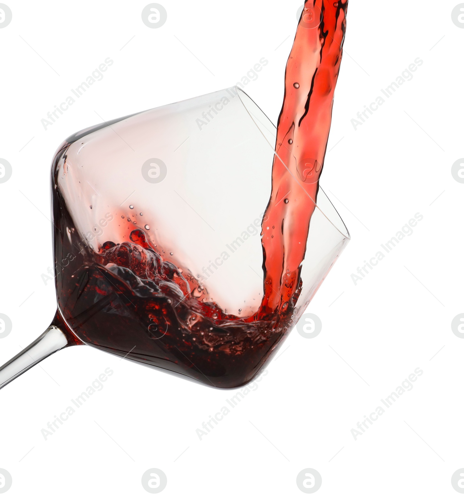 Photo of Pouring red wine into glass isolated on white